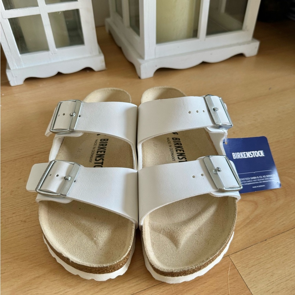 Birkenstock White Arizona Two-Strap Sandals with Silver Buckles
